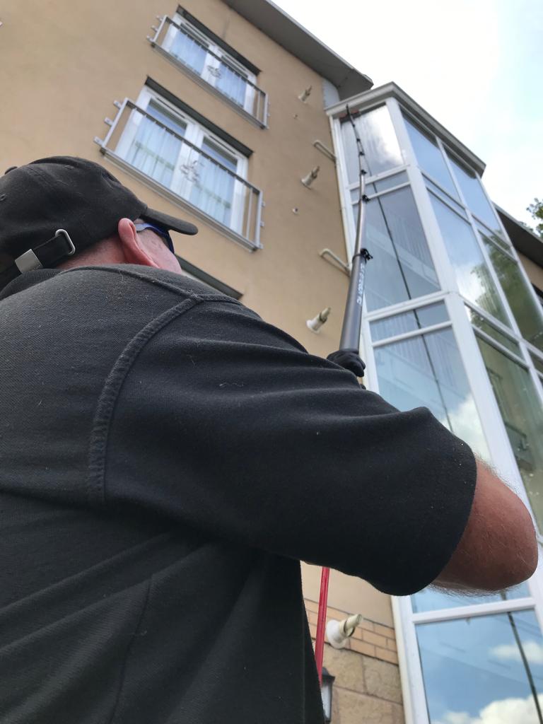 Cleaning 4 storeys with a carbon pole
